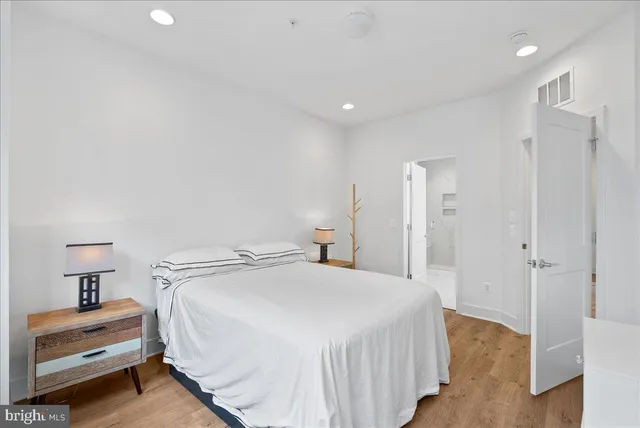 a bedroom with a bed and a view of bedroom