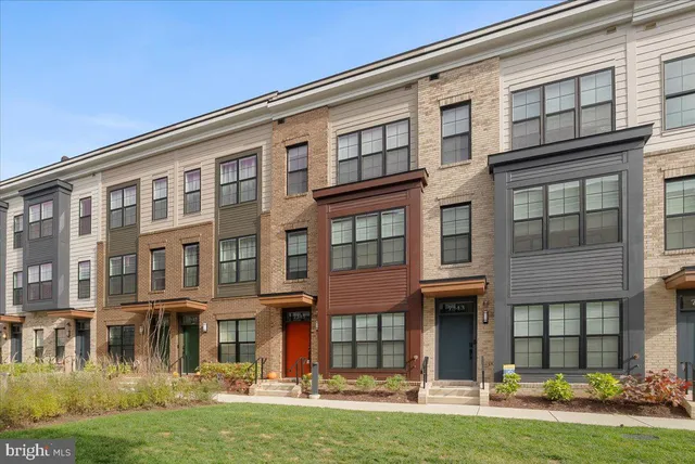 a front view of a building with a yard