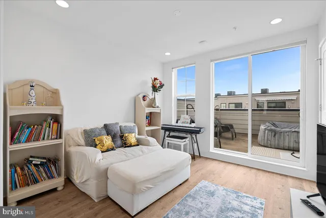 a bedroom with furniture and a book shelf