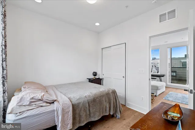 a bedroom with a bed and a view of bathroom