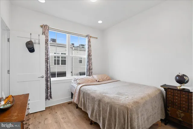 a bedroom with a bed and a dresser