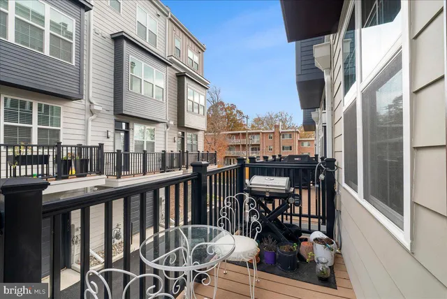 a view of a balcony with chairs