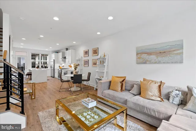 a living room with furniture and a table