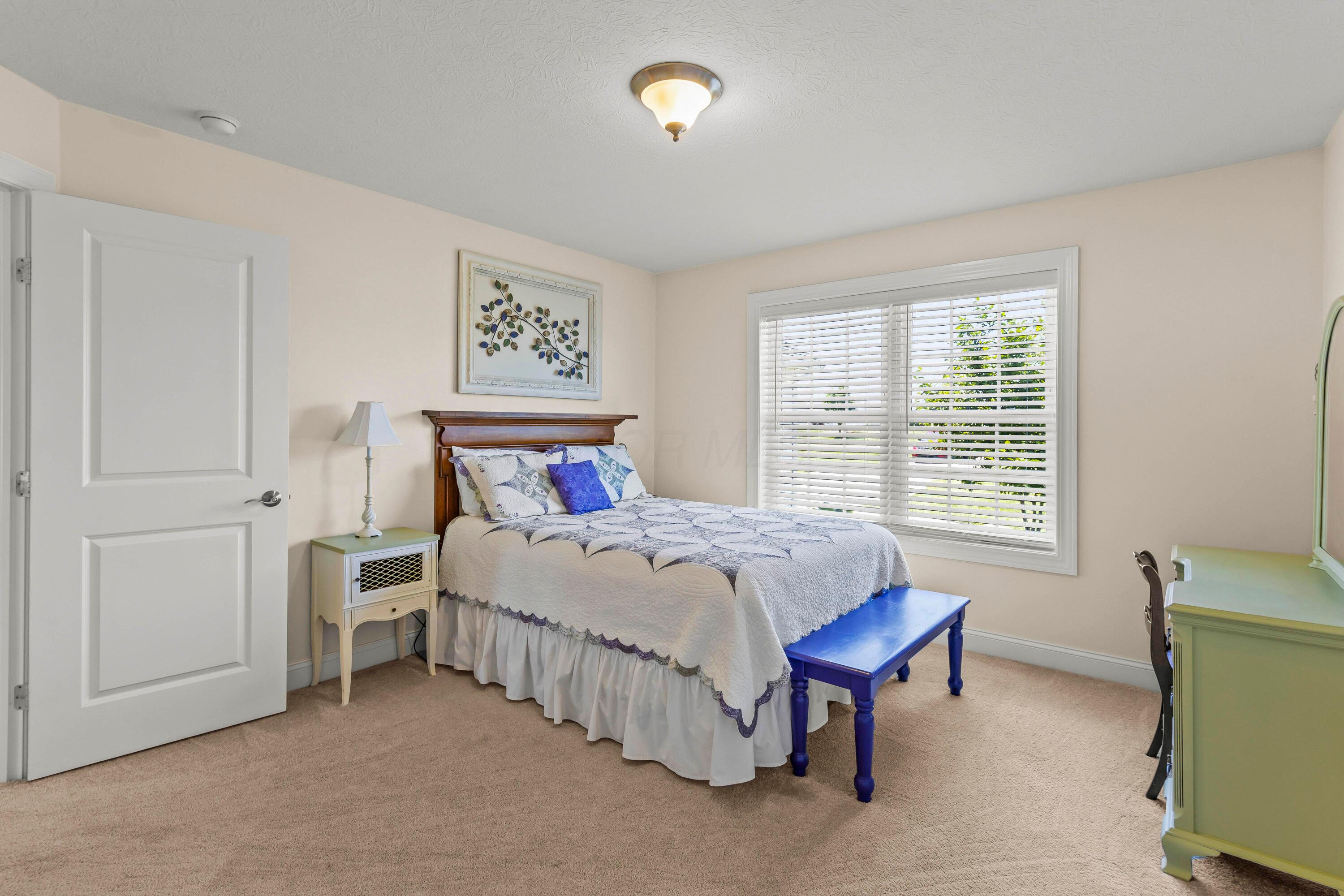 3582 Panhandle Road Delaware, OH 43015 - Photo 19 of 65 • Light sand carpet • Ivory painted walls • Ceiling light • Lighted closet with (2) doors • Headboard does not remain • 2” blinds