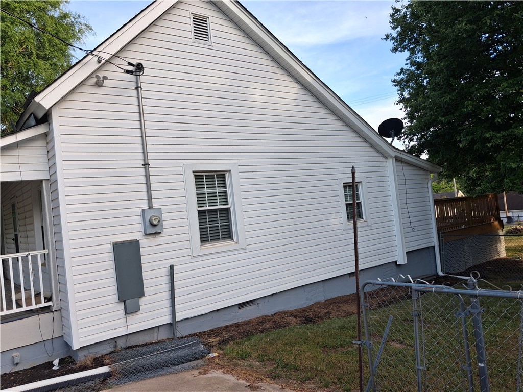 6 Allen Street Pelzer, SC 29669 - Photo 2 of 13 This charming home offers classic siding and a practical exterior with outdoor living space.