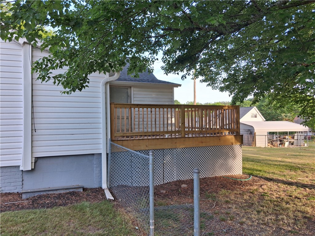 6 Allen Street Pelzer, SC 29669 - Photo 3 of 13 This residence features a charming deck overlooking a spacious backyard.