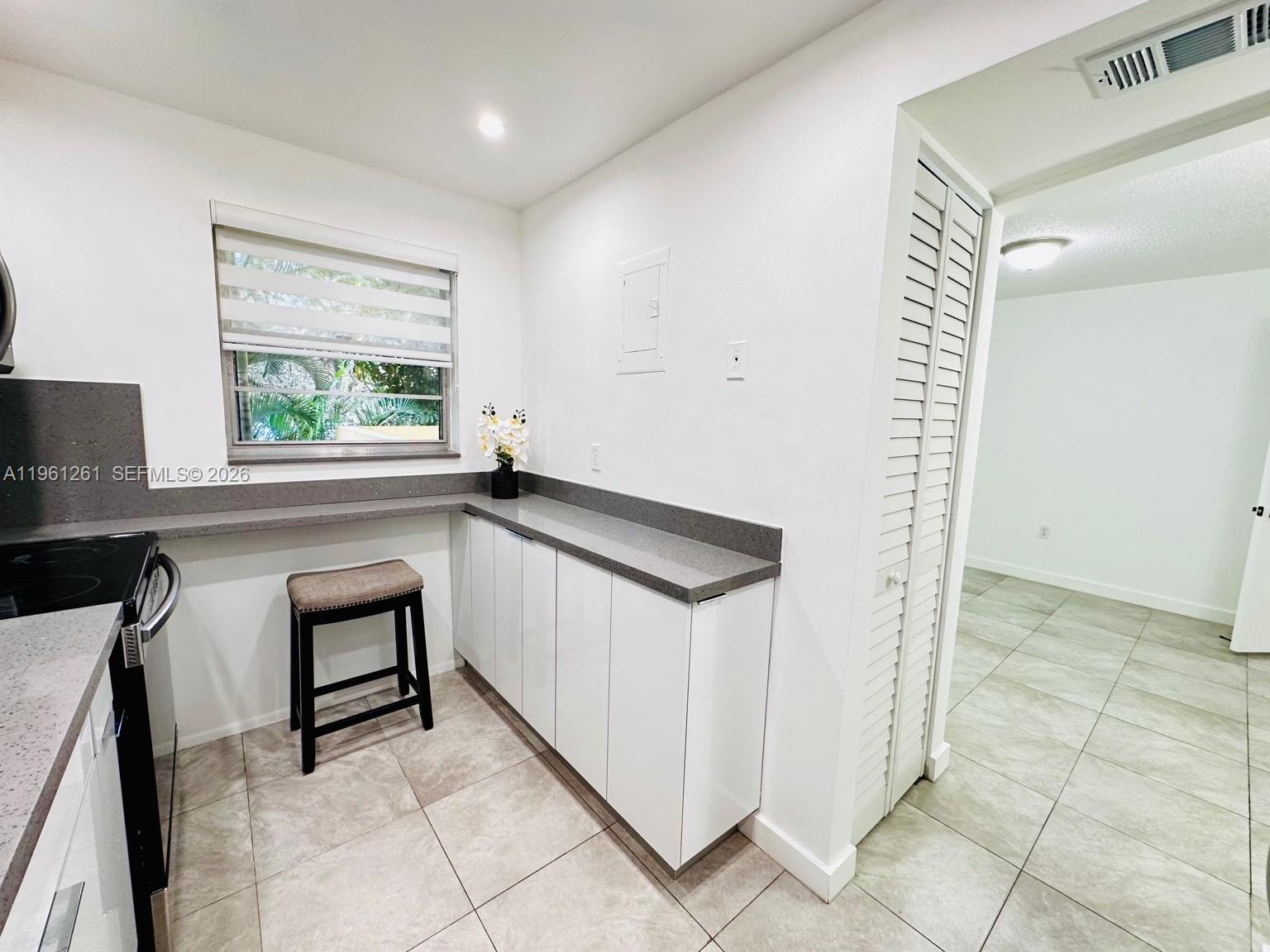 3490 Foxcroft Road, Unit B208 Miramar, FL 33025 - Photo 13 of 32 a view of front door with chair