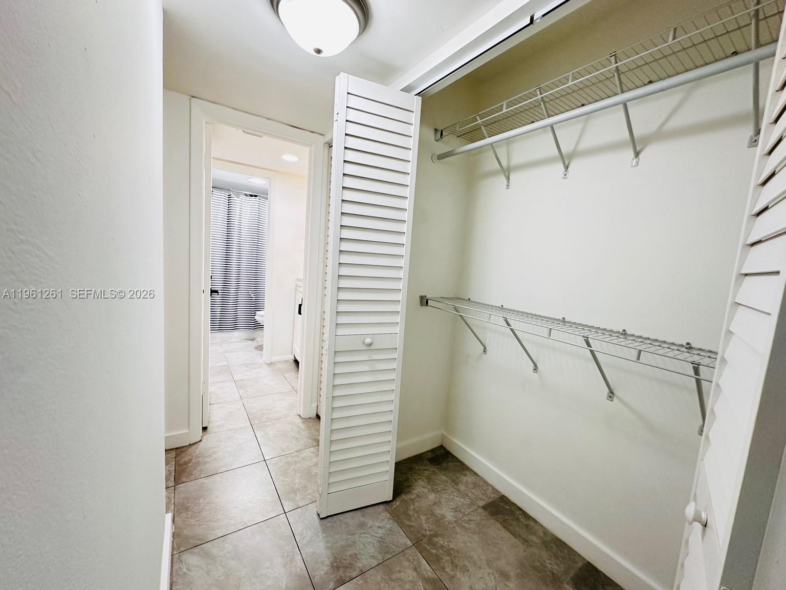 3490 Foxcroft Road, Unit B208 Miramar, FL 33025 - Photo 14 of 32 a view of walk in closet