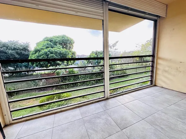 a view of a couple of benches sitting in front of a window