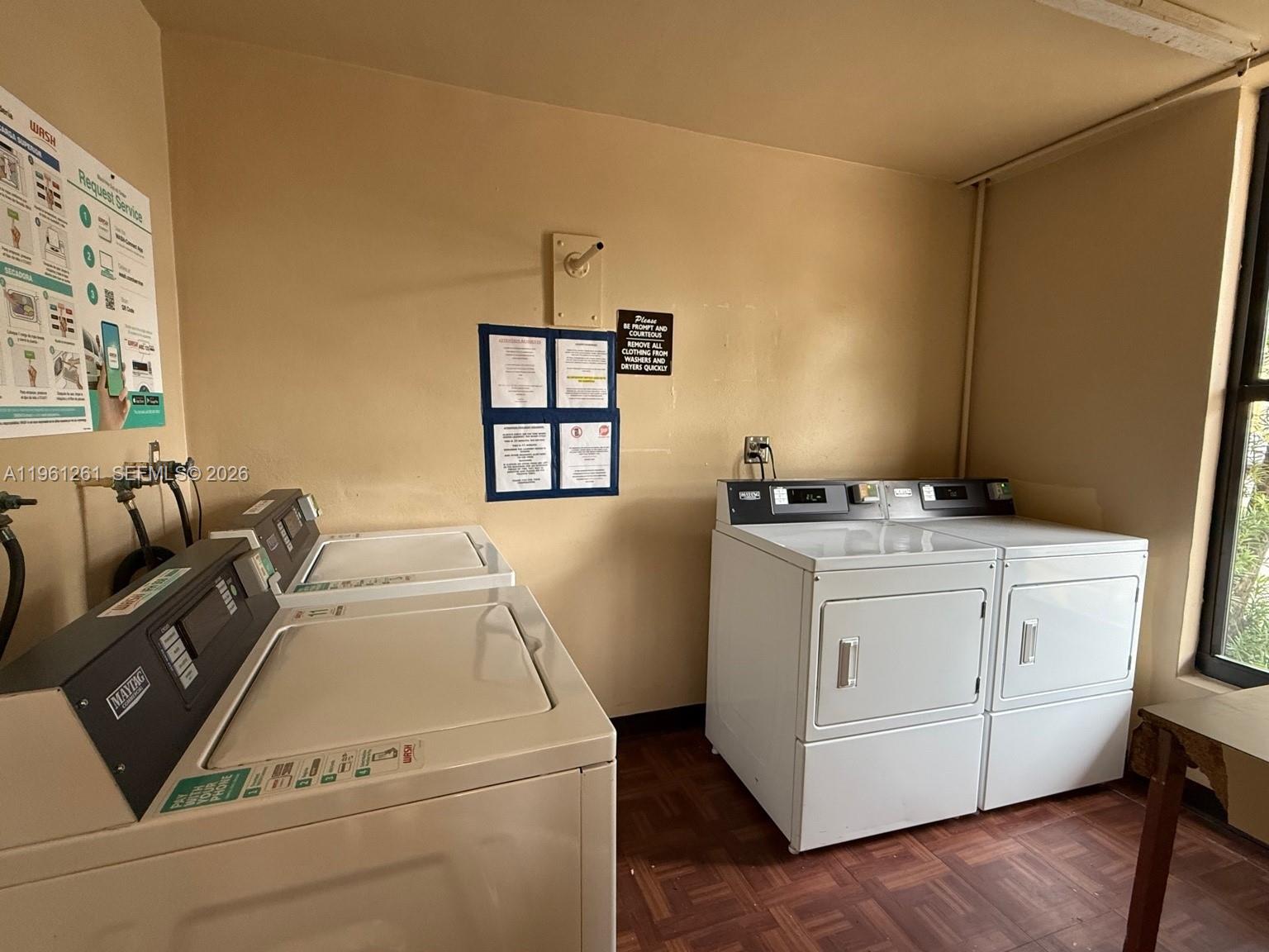 3490 Foxcroft Road, Unit B208 Miramar, FL 33025 - Photo 30 of 32 a utility room with dryer and washer