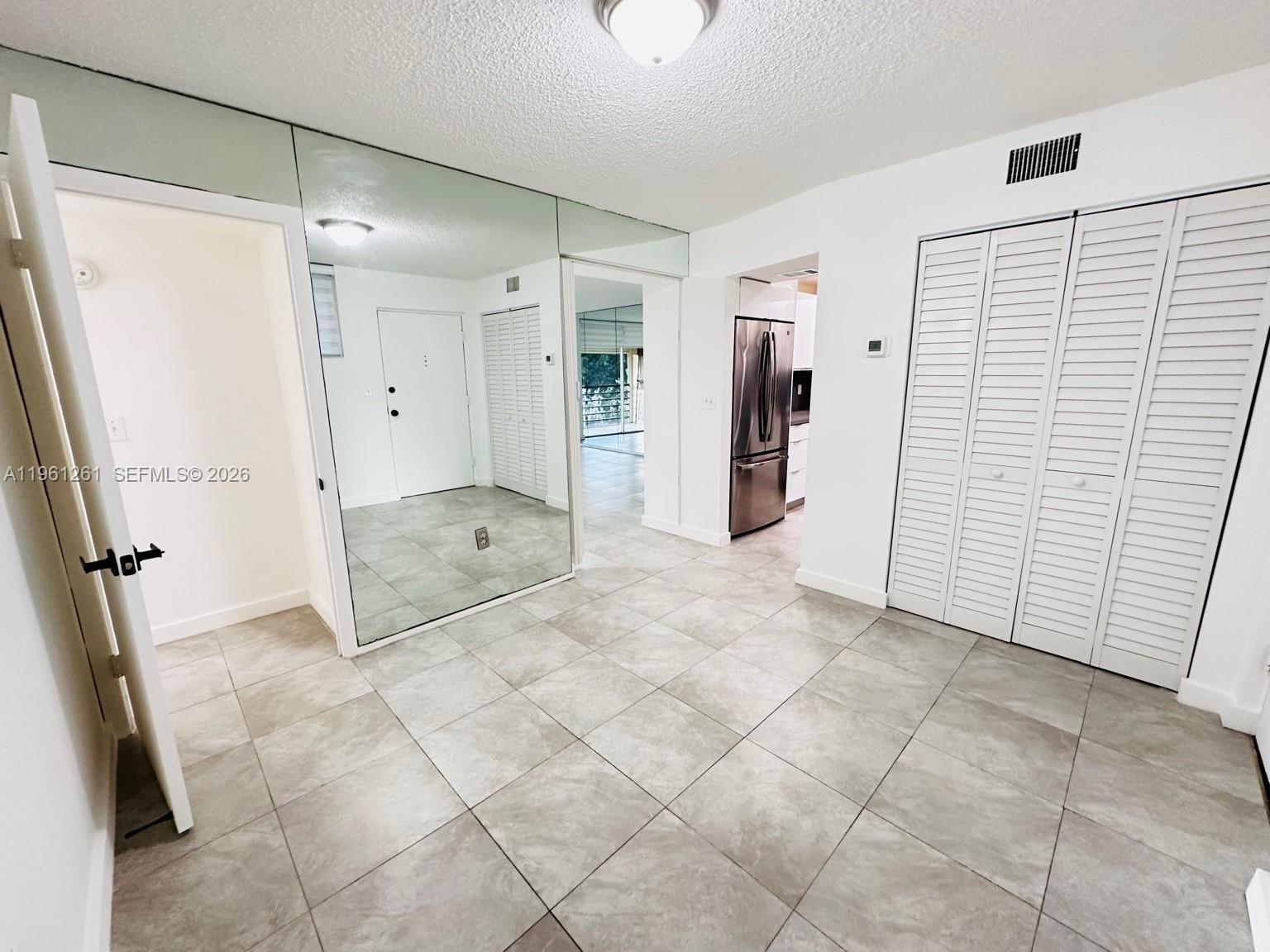 3490 Foxcroft Road, Unit B208 Miramar, FL 33025 - Photo 4 of 32 a view of entryway with white walls and shower