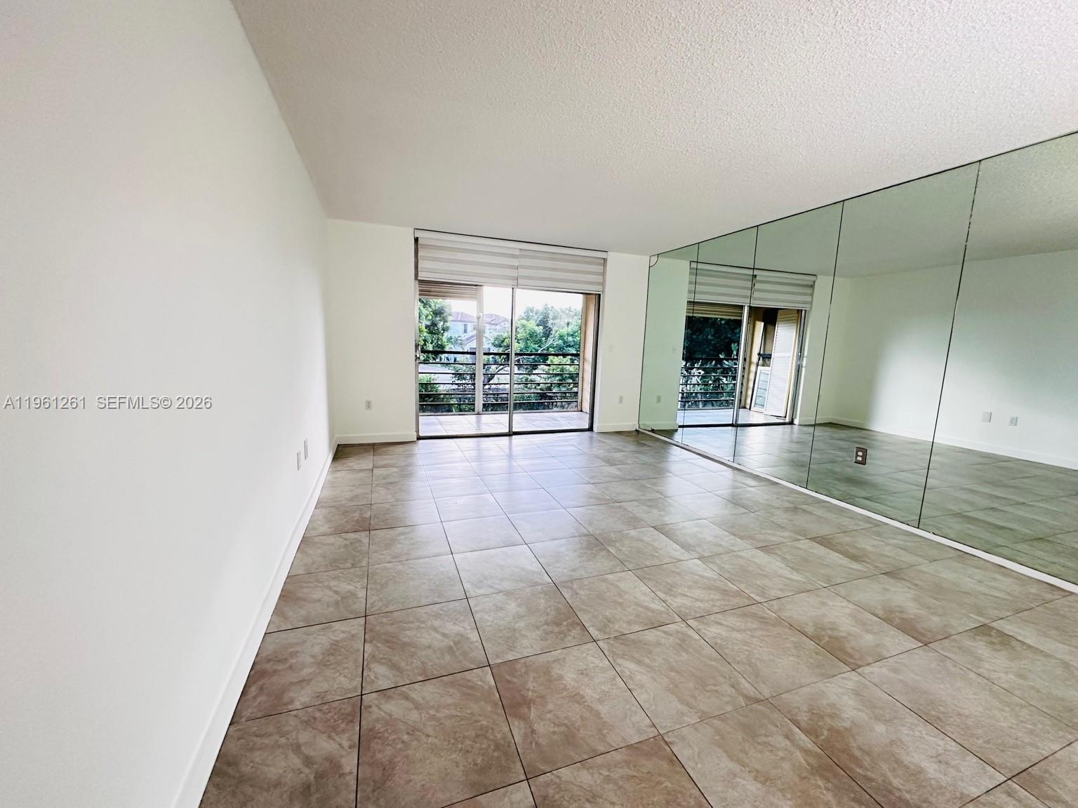 3490 Foxcroft Road, Unit B208 Miramar, FL 33025 - Photo 5 of 32 a view of an empty room with a window