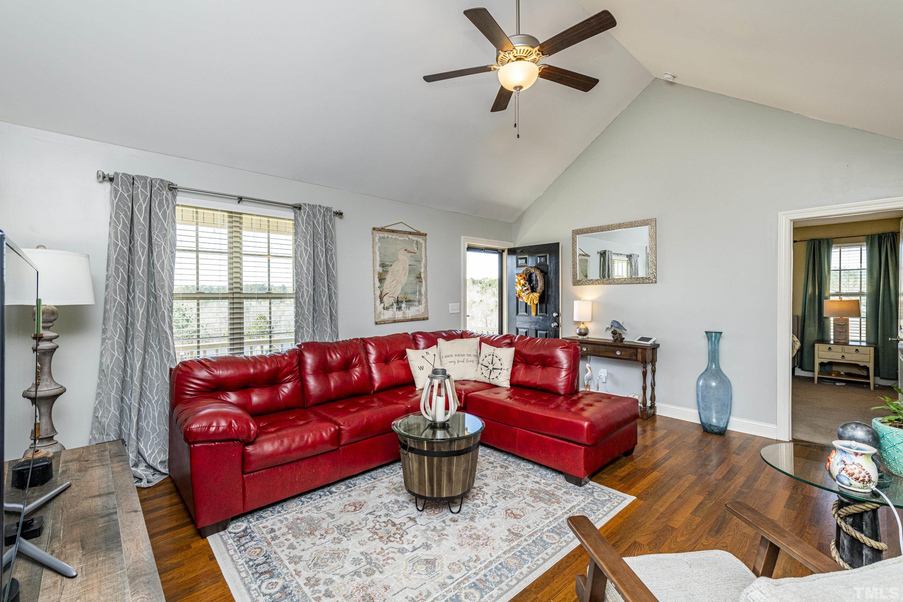 312 Wick Road Stem, NC 27581 - Photo 14 of 34 a living room with furniture kitchen view and a large window