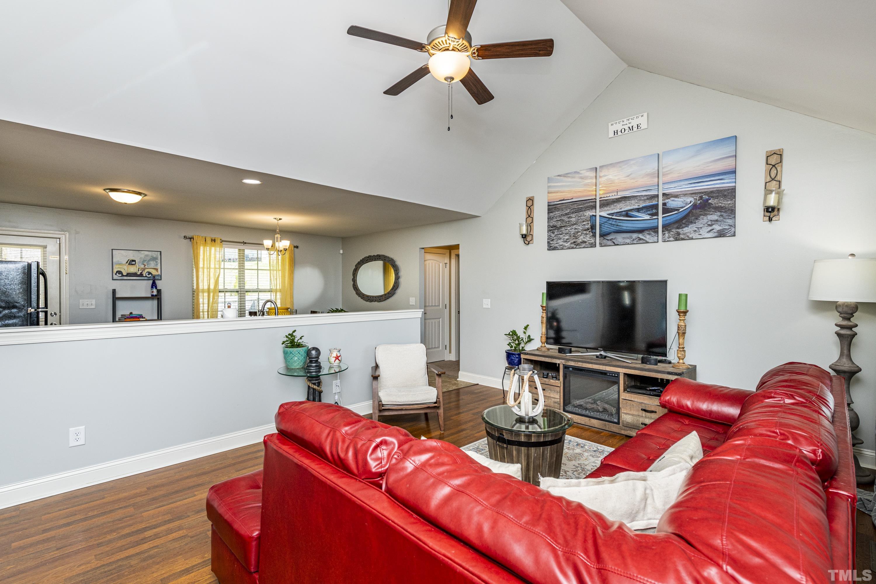 312 Wick Road Stem, NC 27581 - Photo 15 of 34 a living room with furniture and a flat screen tv