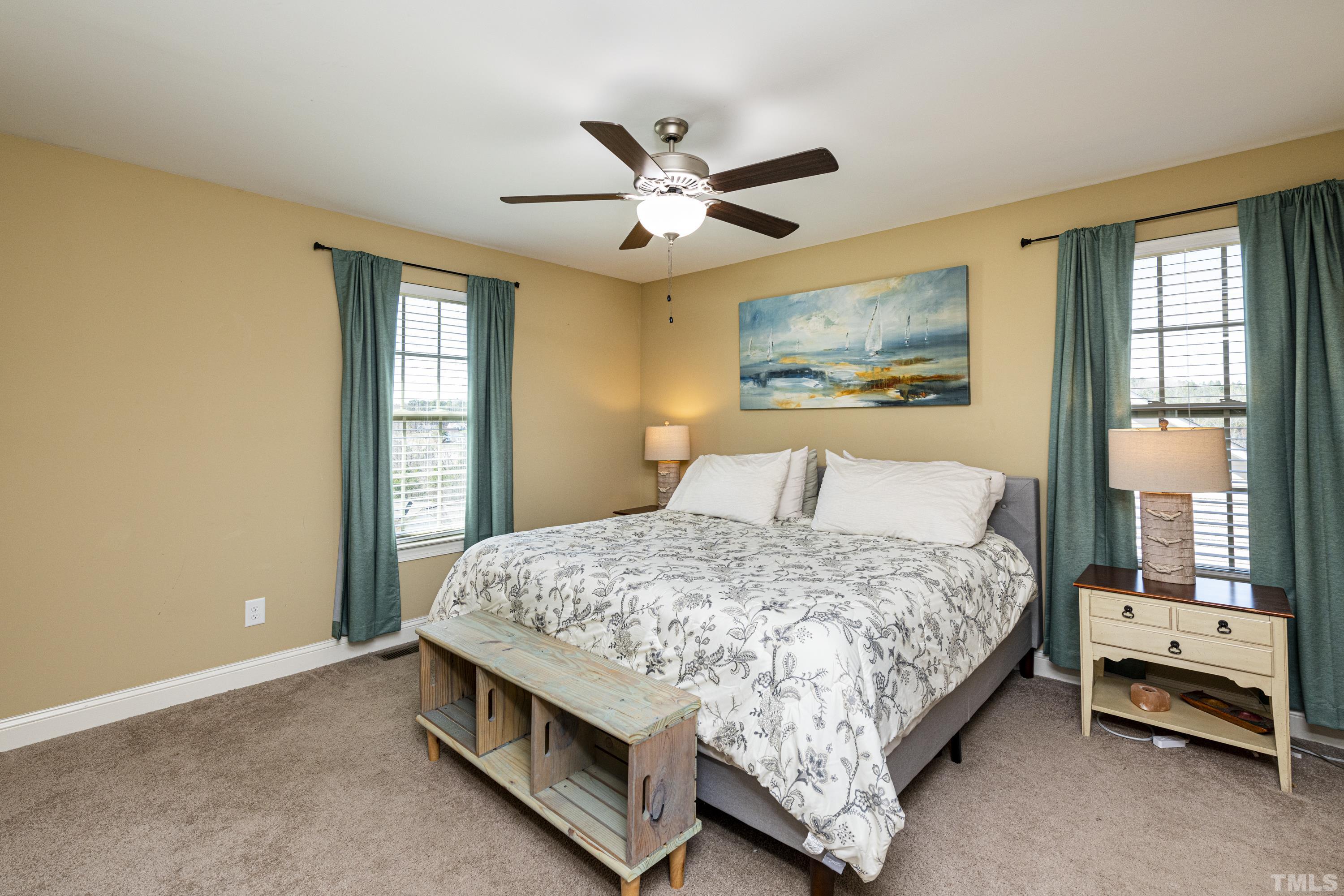 312 Wick Road Stem, NC 27581 - Photo 18 of 34 a bedroom with a bed and a window