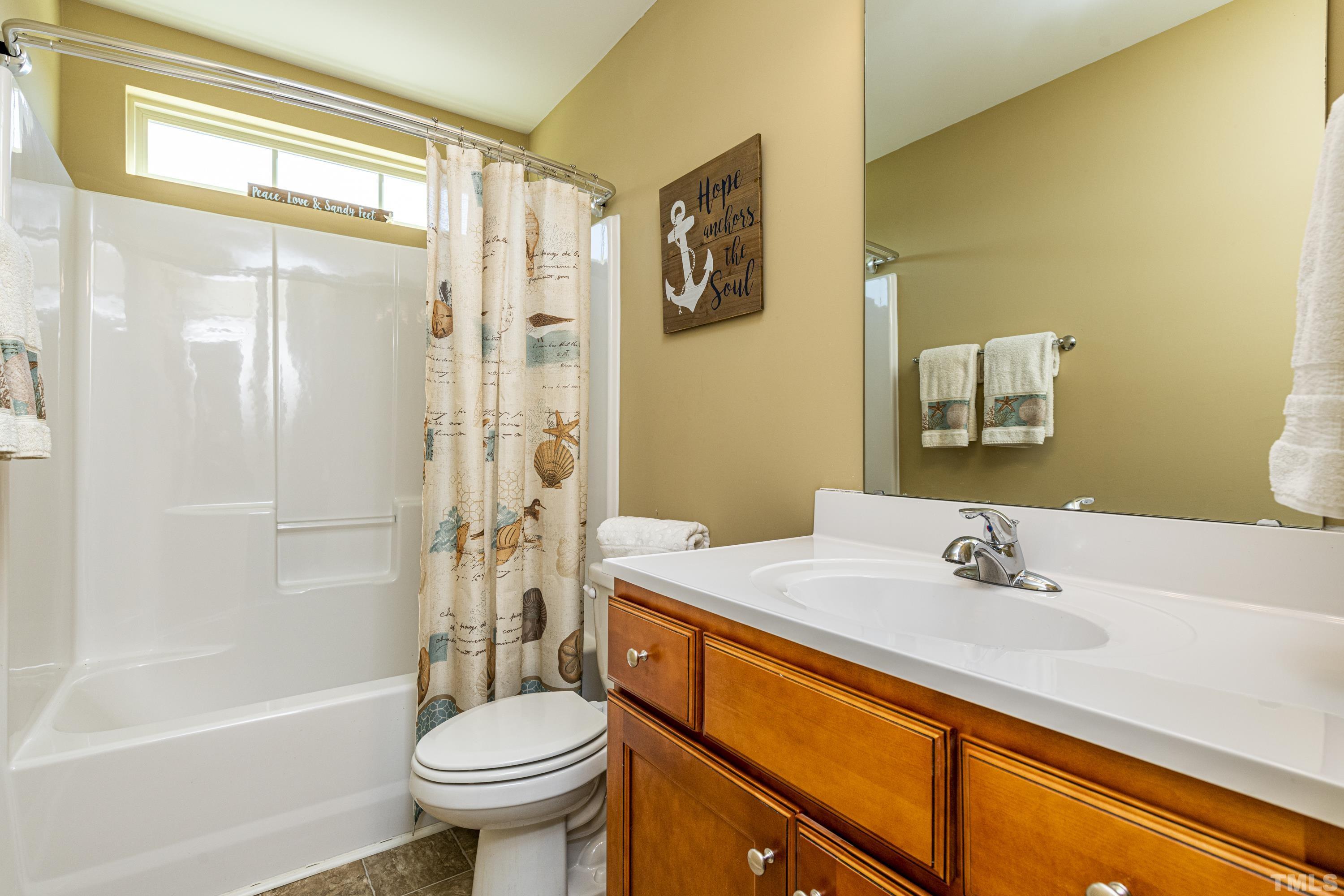 312 Wick Road Stem, NC 27581 - Photo 24 of 34 a bathroom with a sink toilet and shower