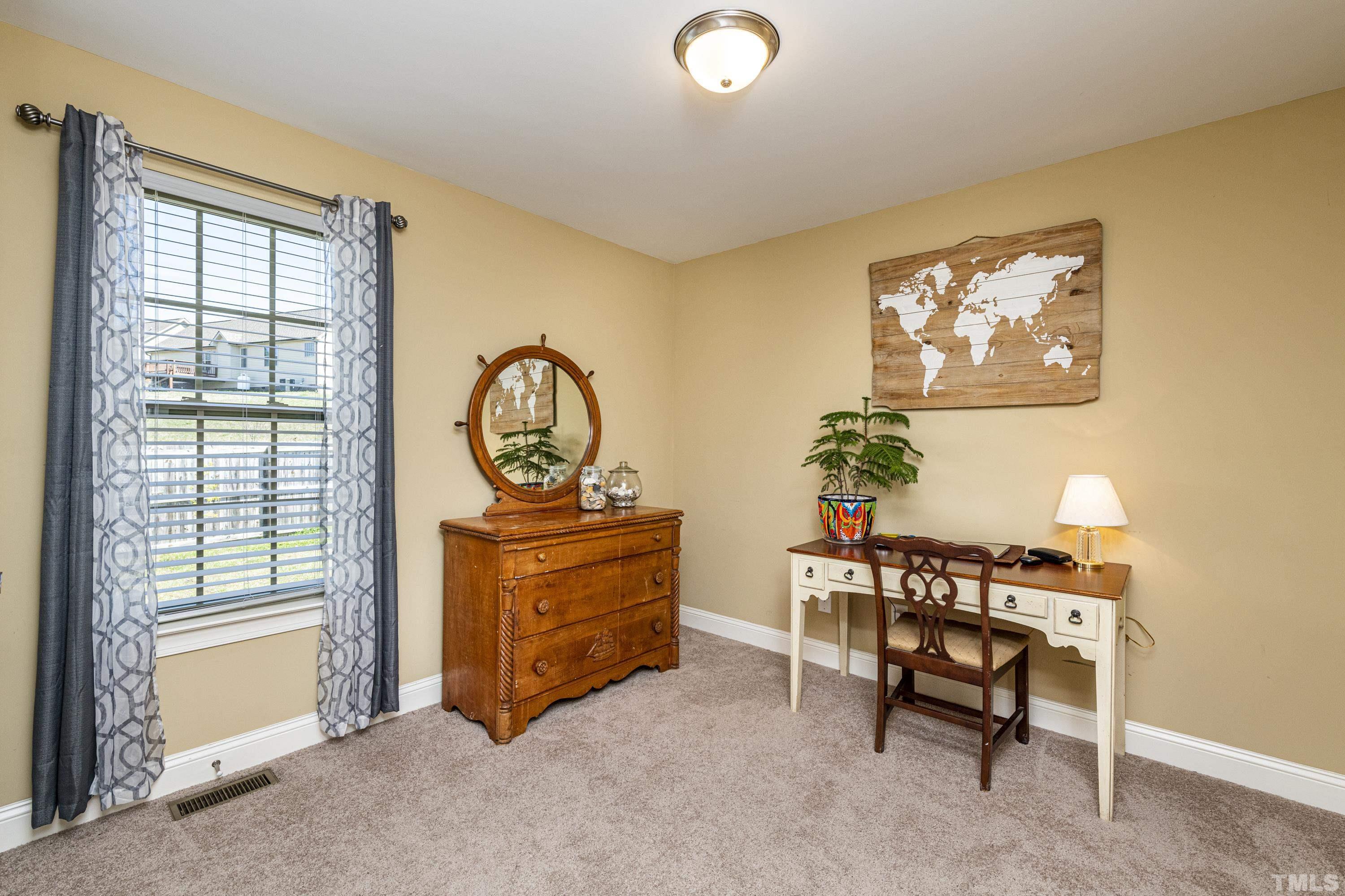 312 Wick Road Stem, NC 27581 - Photo 25 of 34 a room with furniture and window