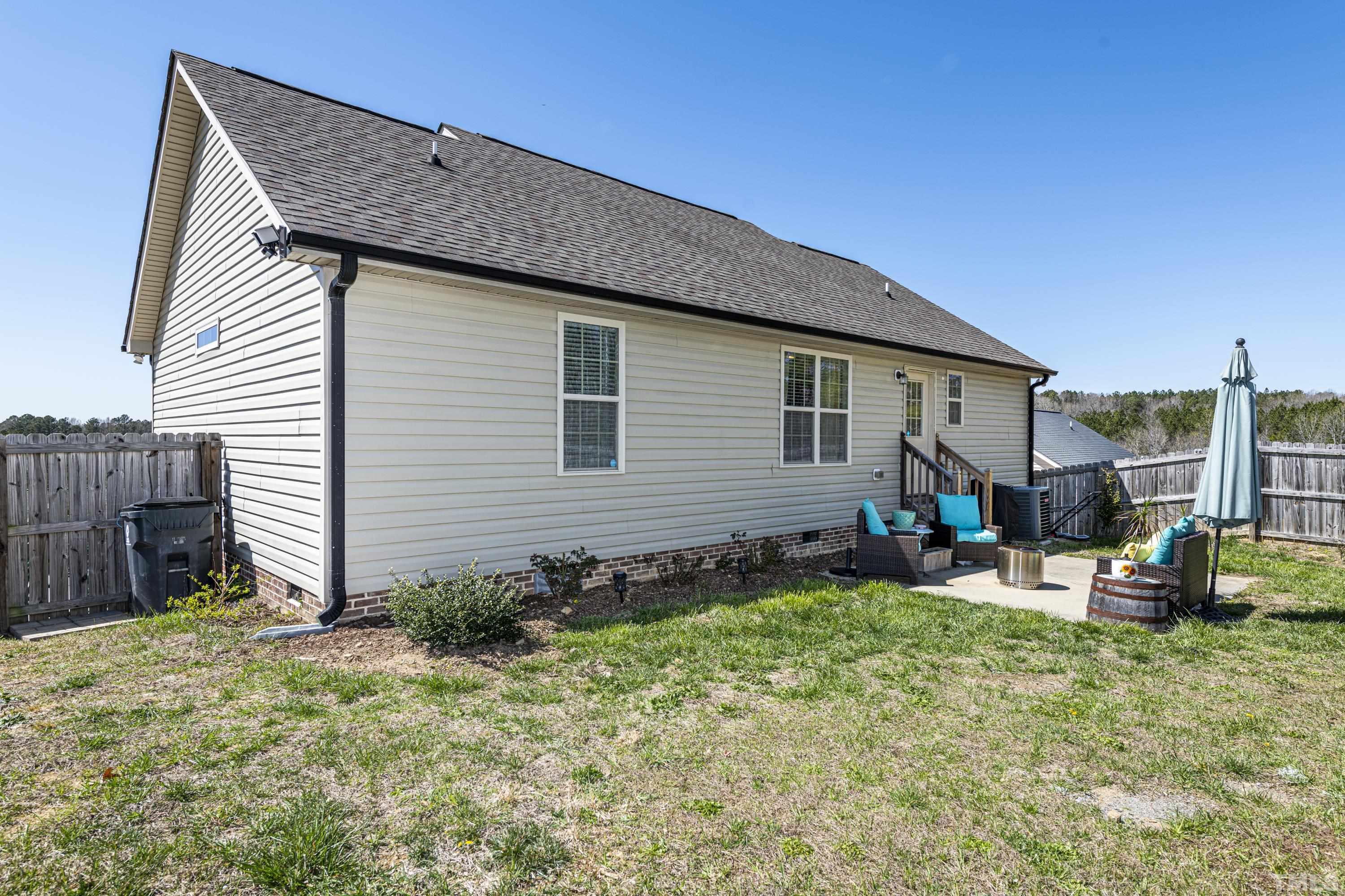 312 Wick Road Stem, NC 27581 - Photo 29 of 34 a front view of a house with garden