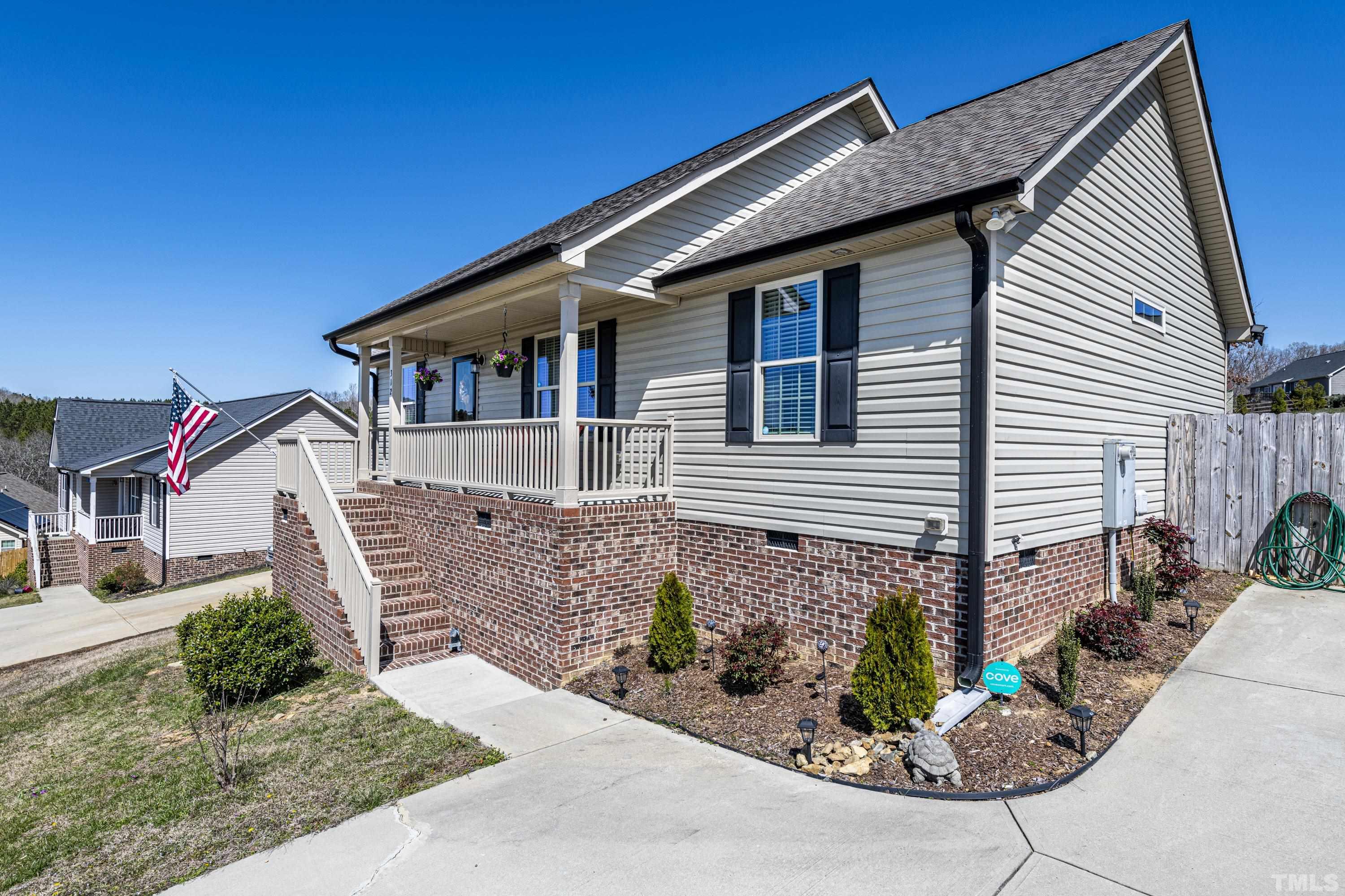 312 Wick Road Stem, NC 27581 - Photo 4 of 34 a front view of a house with garden