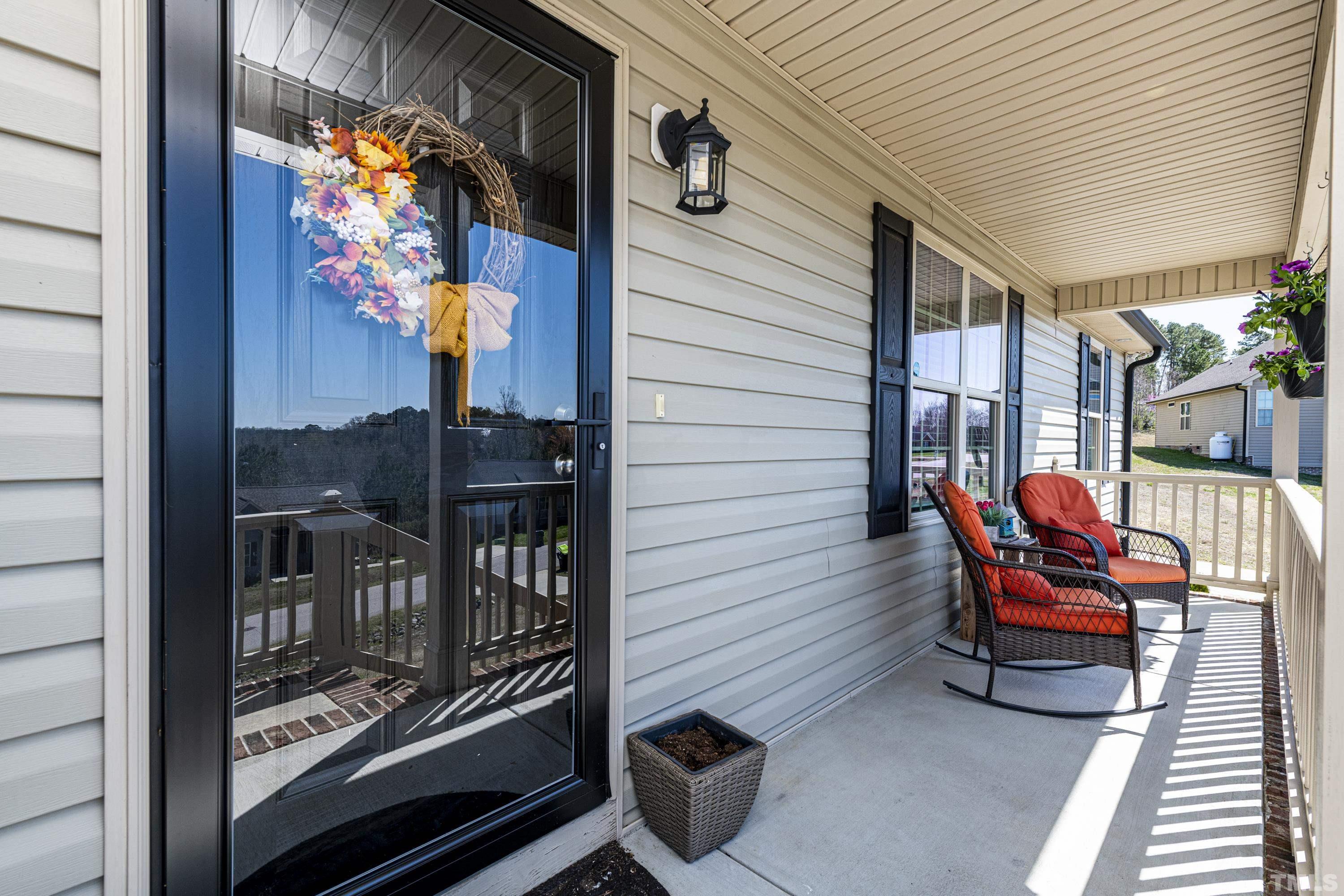 312 Wick Road Stem, NC 27581 - Photo 5 of 34 a bench sitting in front of a building