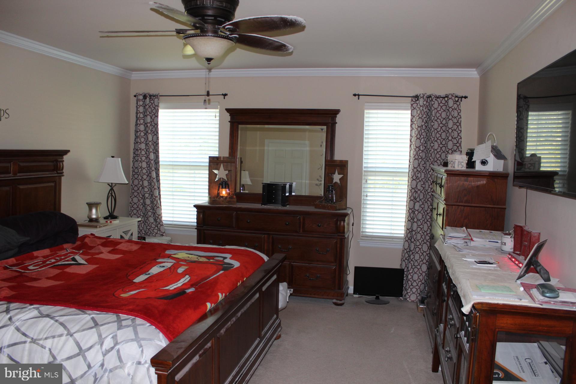 2 Jennifer Court Reading, PA 19608 - Photo 23 of 45 a bedroom with a bed and a chandelier