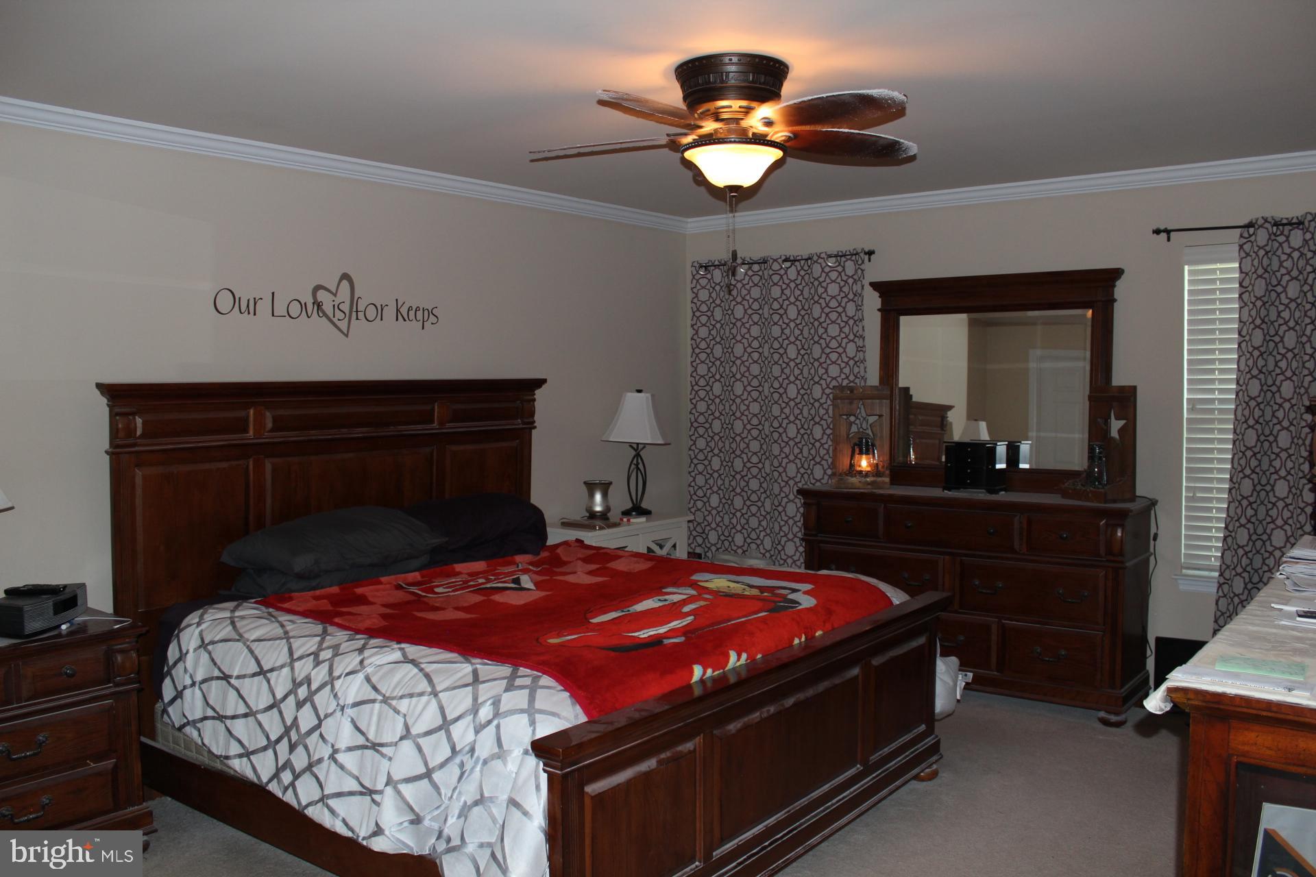 2 Jennifer Court Reading, PA 19608 - Photo 24 of 45 a bedroom with a bed and a chandelier
