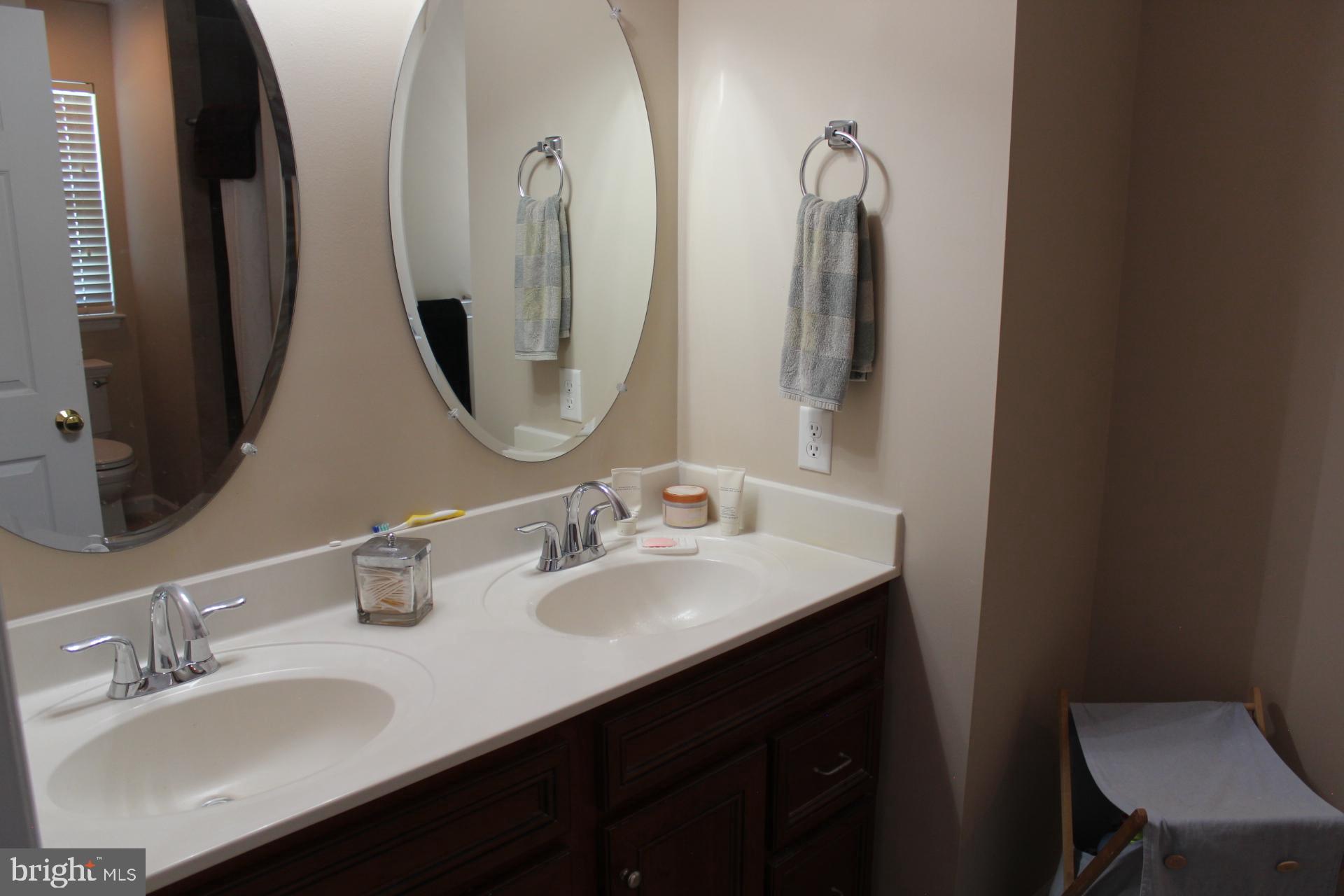 2 Jennifer Court Reading, PA 19608 - Photo 25 of 45 a bathroom with a double vanity sink and a mirror