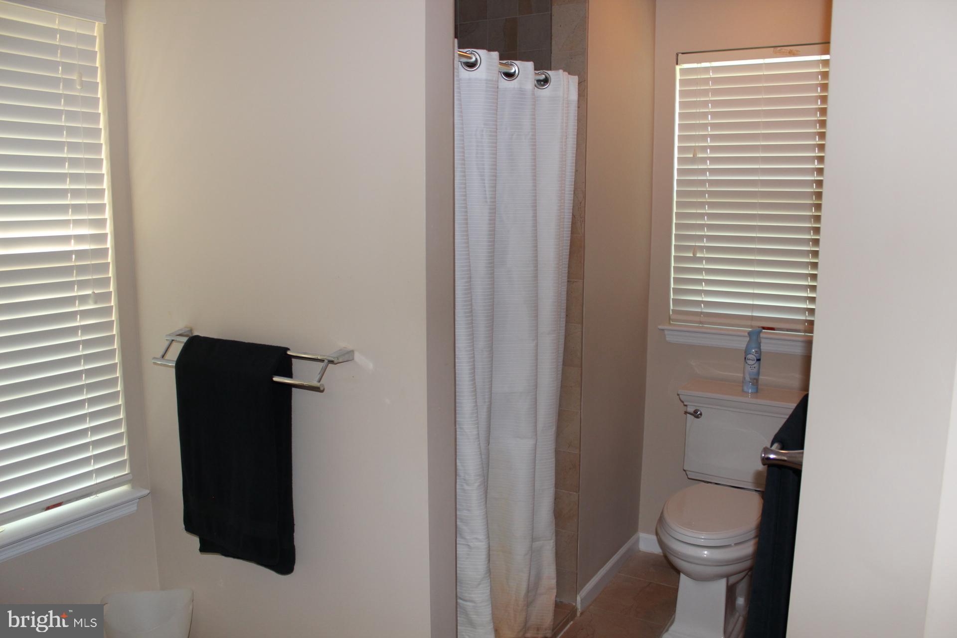 2 Jennifer Court Reading, PA 19608 - Photo 26 of 45 a bathroom with a toilet and a shower curtain