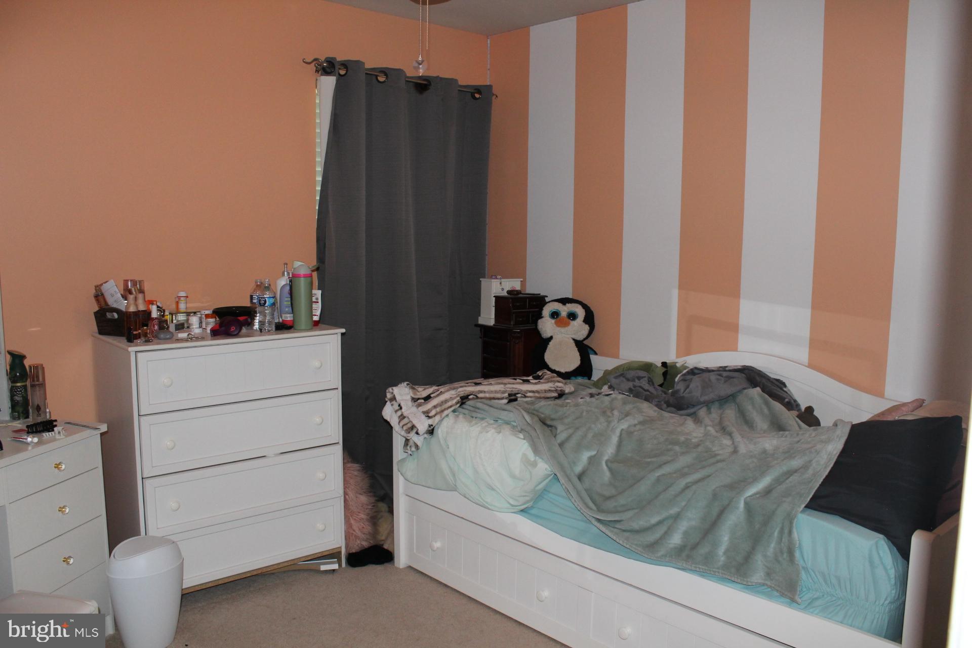 2 Jennifer Court Reading, PA 19608 - Photo 32 of 45 a bed sitting in a bedroom next to a cabinet