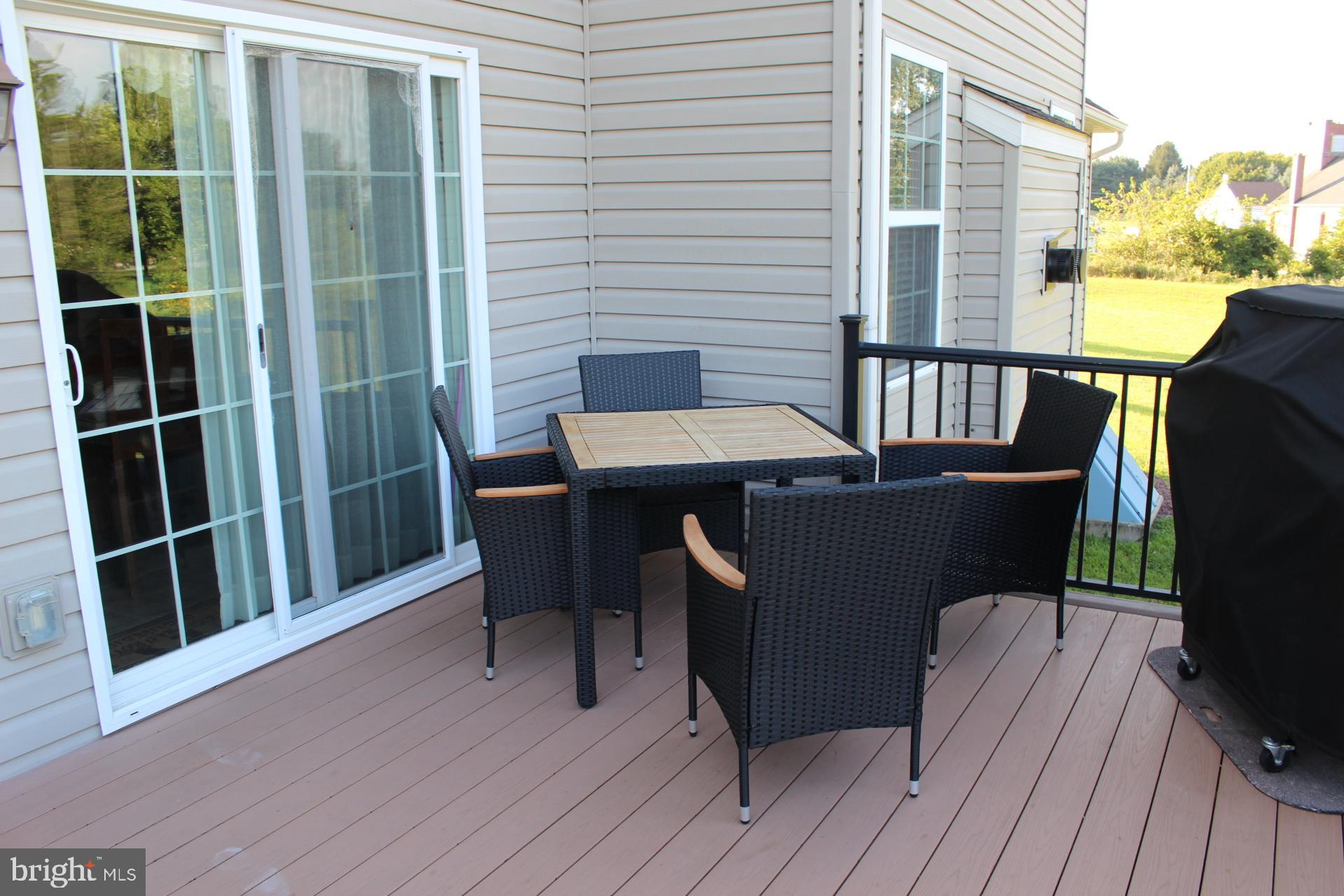 2 Jennifer Court Reading, PA 19608 - Photo 10 of 45 a view of a deck with table and chairs with wooden floor and fence