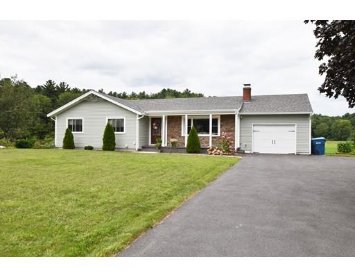 306 Bolton Road Lancaster, MA 01523 - Photo 1 of 30 a front view of a house with a garden and yard