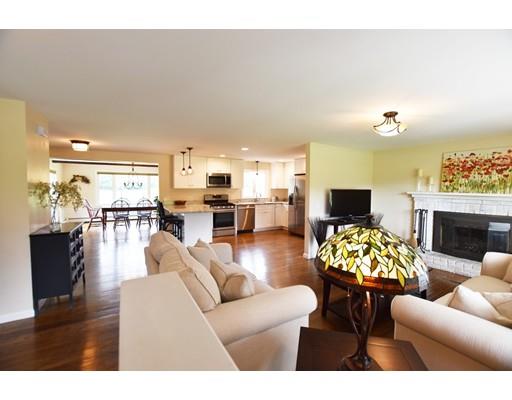 306 Bolton Road Lancaster, MA 01523 - Photo 2 of 30 a living room with furniture kitchen view and a fireplace