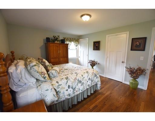 306 Bolton Road Lancaster, MA 01523 - Photo 21 of 30 a bedroom with a bed and a couch