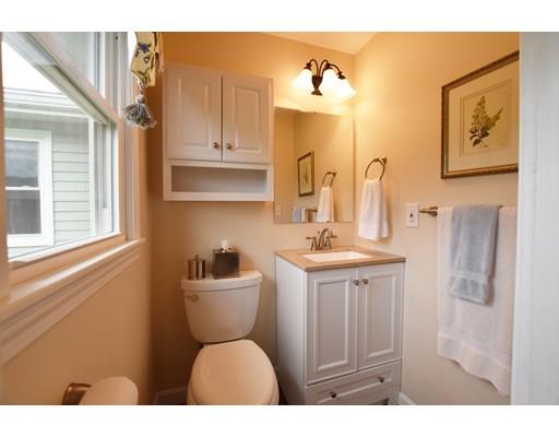 306 Bolton Road Lancaster, MA 01523 - Photo 22 of 30 a bathroom with a toilet sink and mirror
