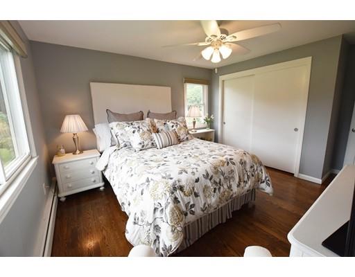 306 Bolton Road Lancaster, MA 01523 - Photo 25 of 30 a bedroom with a bed and a window with wooden floor