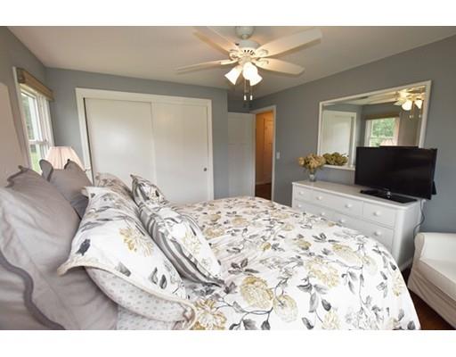 306 Bolton Road Lancaster, MA 01523 - Photo 26 of 30 a bedroom with a bed and a television