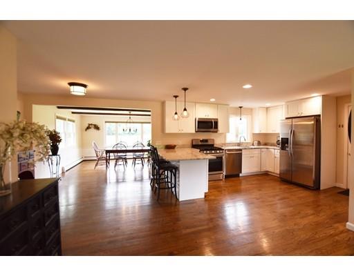 306 Bolton Road Lancaster, MA 01523 - Photo 5 of 30 a kitchen with a refrigerator sink and cabinets