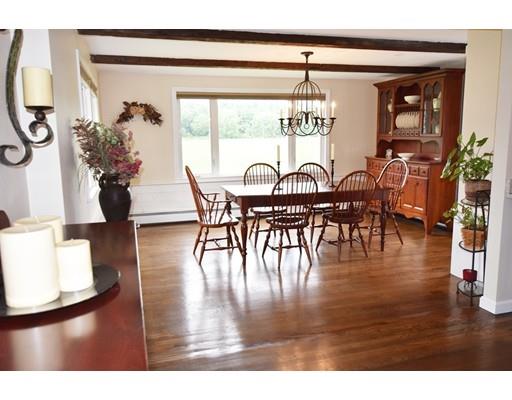 306 Bolton Road Lancaster, MA 01523 - Photo 7 of 30 a view of a dining room with furniture window and wooden floor