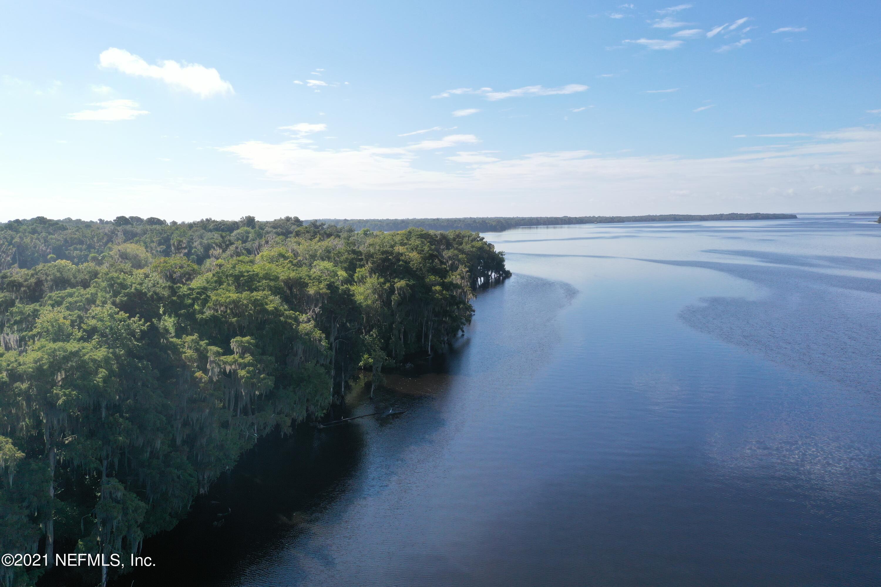a view of a lake from a yard