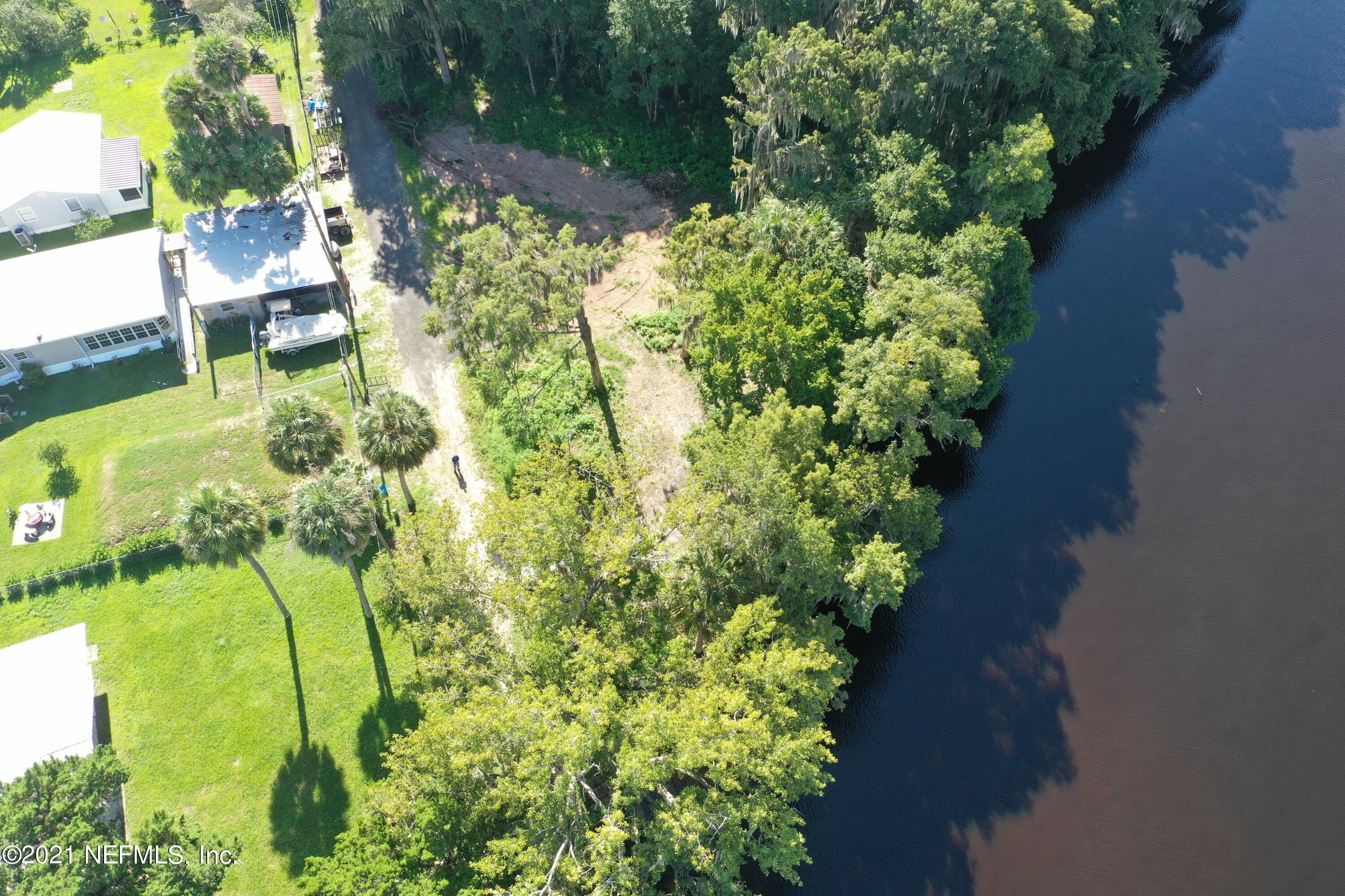 0 Wooten Rd Crescent Crescent City, FL 32112 - Photo 5 of 26 a view of yard with table and chairs and potted plants