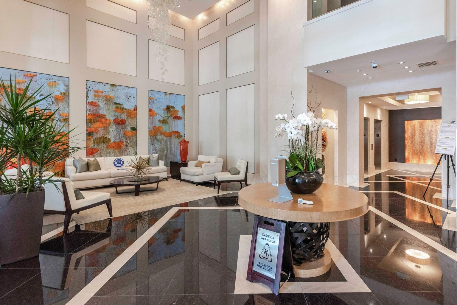 550 Okeechobee Boulevard, Unit 1718 West Palm Beach, FL 33401 - Photo 2 of 13 a view of a dining room with furniture window and wooden floor