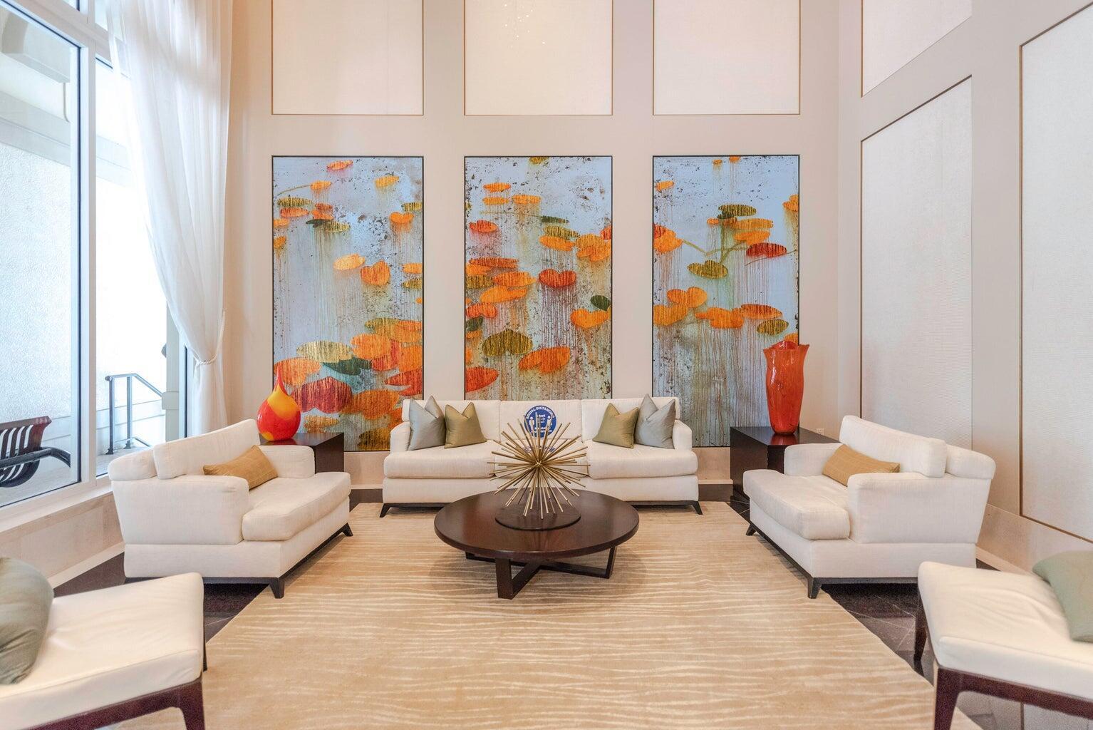 550 Okeechobee Boulevard, Unit 1718 West Palm Beach, FL 33401 - Photo 3 of 13 a living room with furniture and a painting on the wall