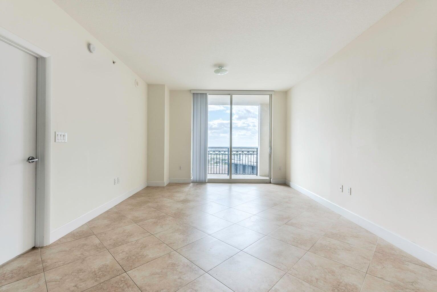 550 Okeechobee Boulevard, Unit 1718 West Palm Beach, FL 33401 - Photo 5 of 13 a view of an empty room with a window