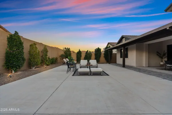 a front view of a house with table and chairs