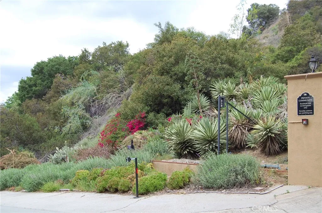 0 Broken Spur Road La Verne, CA 91750 - Photo 3 of 28 a front view of a house with a yard and tree s