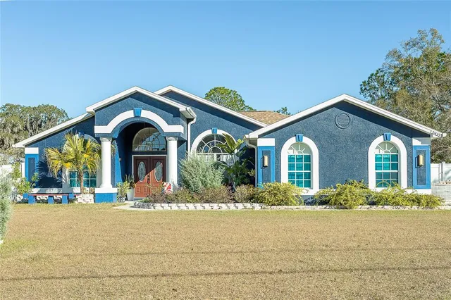a front view of house with a yard