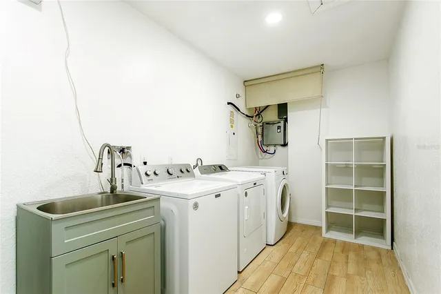 a kitchen with a sink and cabinets