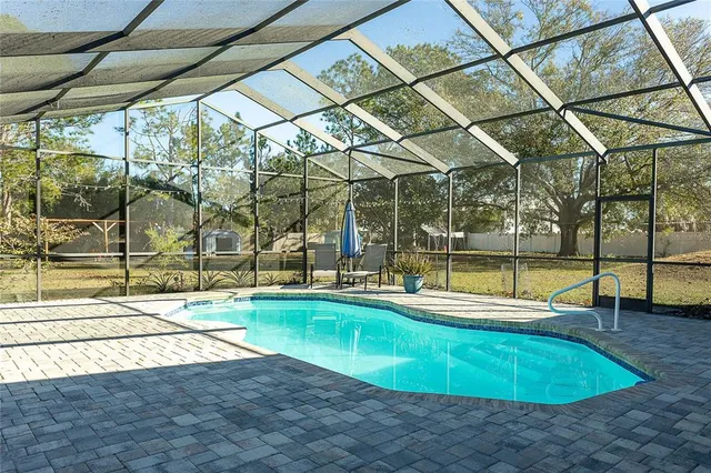 a view of a swimming pool with a patio