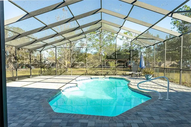 a indoor swimming pool with outdoor seating