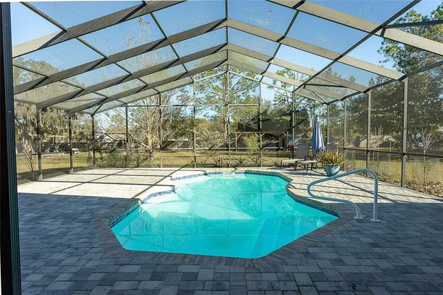 a view of a swimming pool with a patio